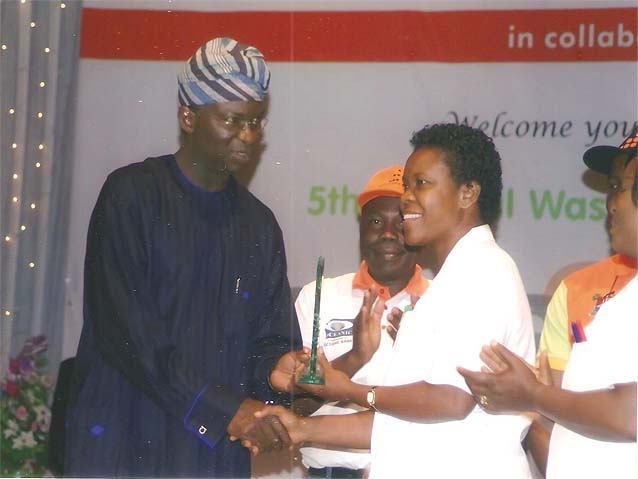 fashola_awarding_emel_matron.jpg